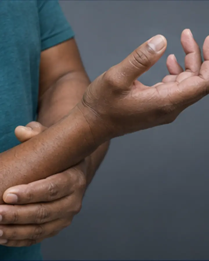 Person experiencing symptoms related to Cubital tunnel syndrome